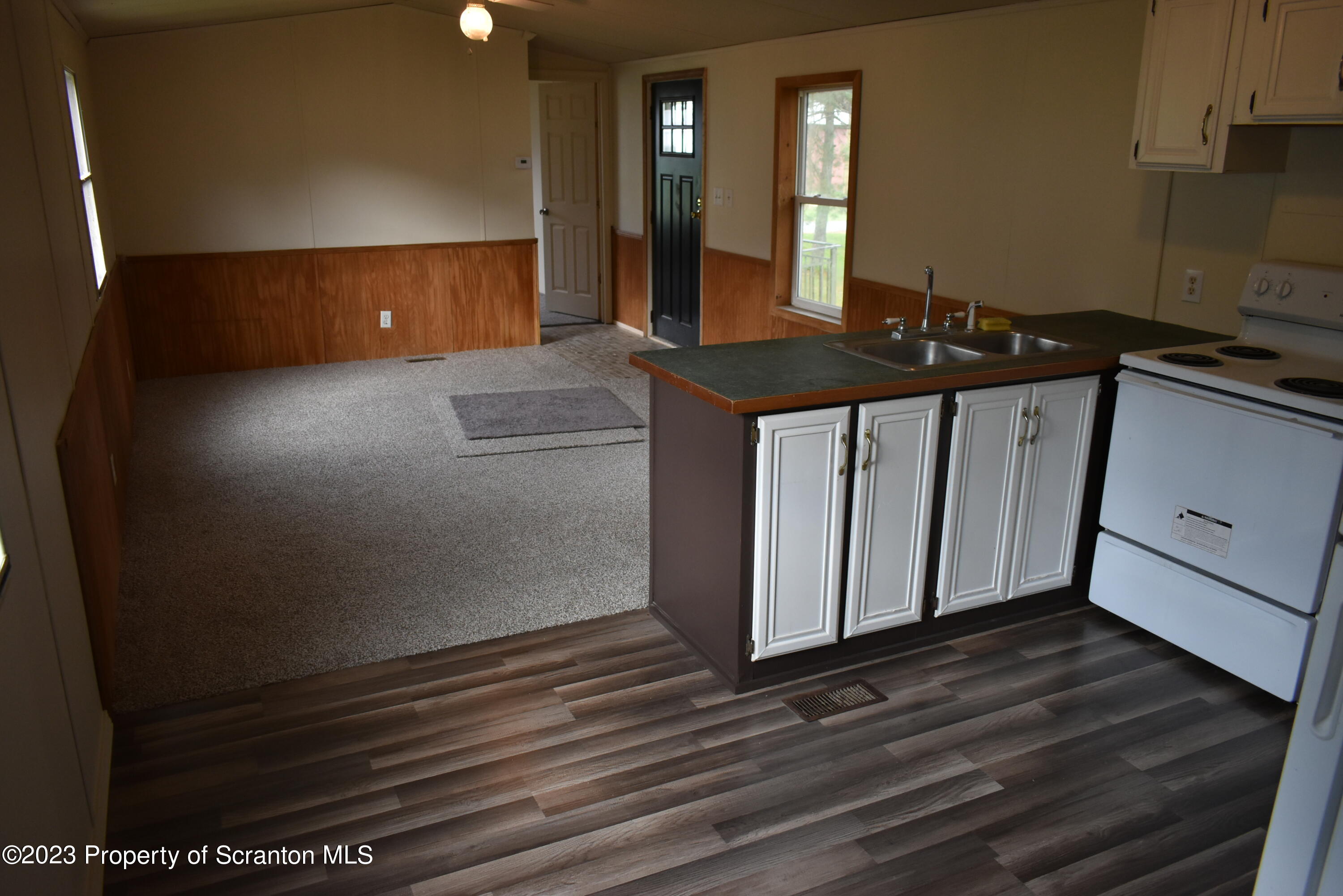 940 Nowlan Road, Unit 6 Port Crane, NY 13833 - Photo 2 of 11 a kitchen with a sink and cabinets