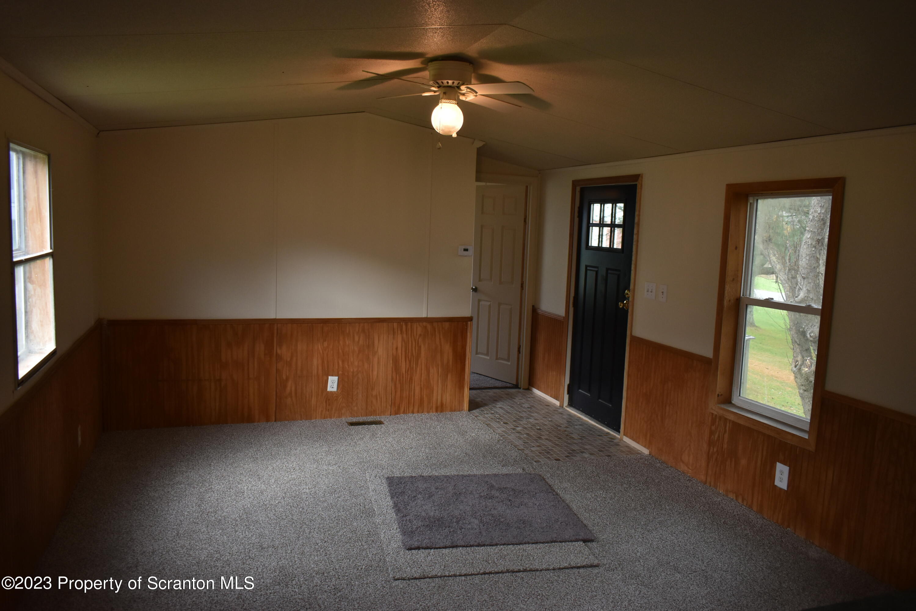 940 Nowlan Road, Unit 6 Port Crane, NY 13833 - Photo 6 of 11 an empty room with windows and fan