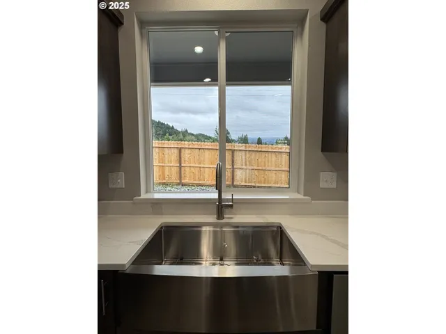 a kitchen with a sink and window