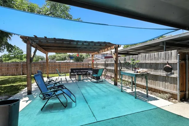 a view of a chairs and table in the patio