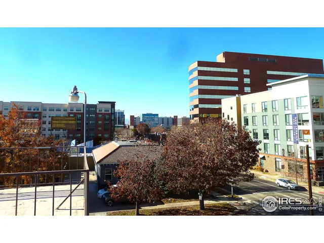 a view of building with view of living room