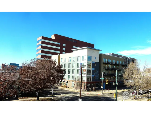 a front view of a building with many windows