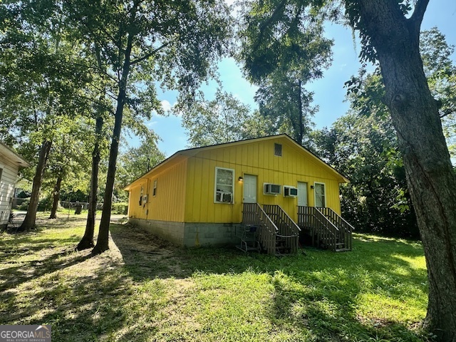 103 Floyd Street Statesboro, GA 30458 - Photo 12 of 22 a view of a house with a yard