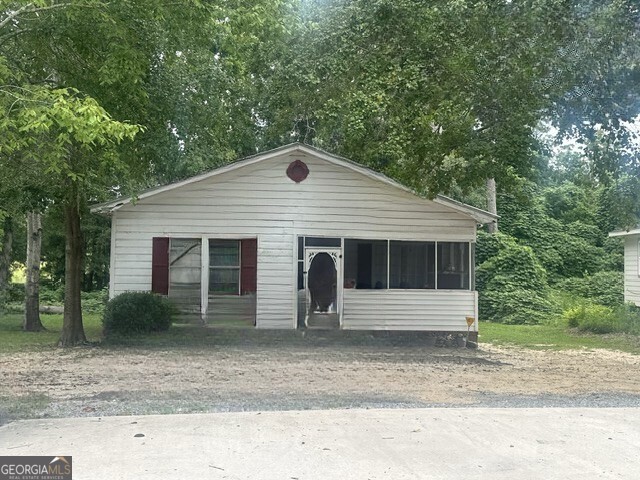 103 Floyd Street Statesboro, GA 30458 - Photo 13 of 22 a front view of a house with garage