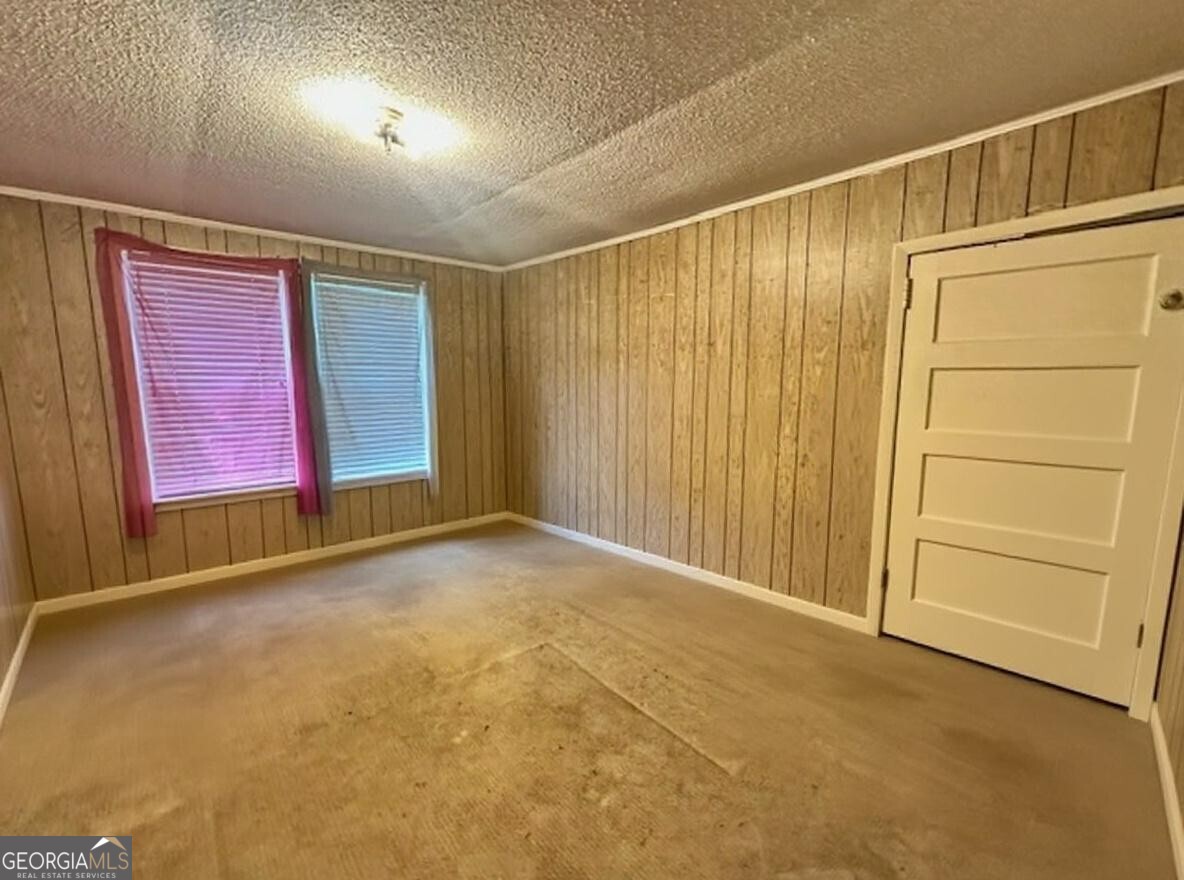 103 Floyd Street Statesboro, GA 30458 - Photo 17 of 22 an empty room with windows