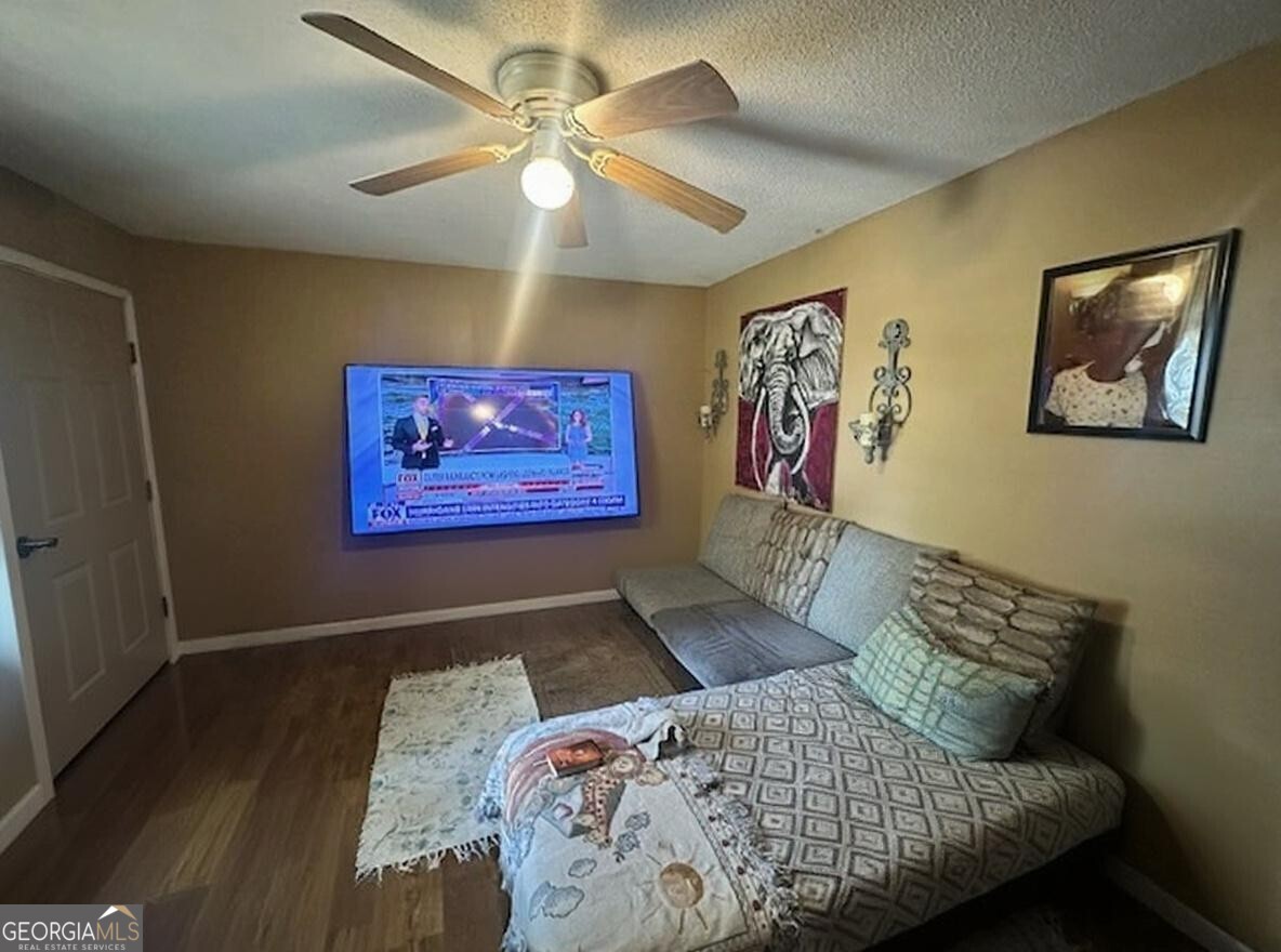 103 Floyd Street Statesboro, GA 30458 - Photo 2 of 22 a bedroom with a bed and a painting on the wall
