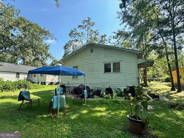 103 Floyd Street Statesboro, GA 30458 - Photo 22 of 22 a backyard of a house with table and chairs