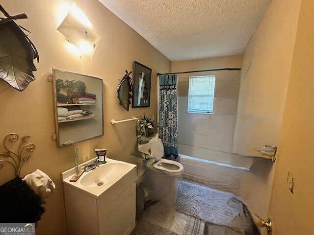 103 Floyd Street Statesboro, GA 30458 - Photo 6 of 22 a bathroom with a sink mirror and tub