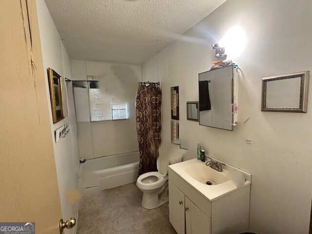 103 Floyd Street Statesboro, GA 30458 - Photo 9 of 22 a bathroom with a toilet sink and mirror