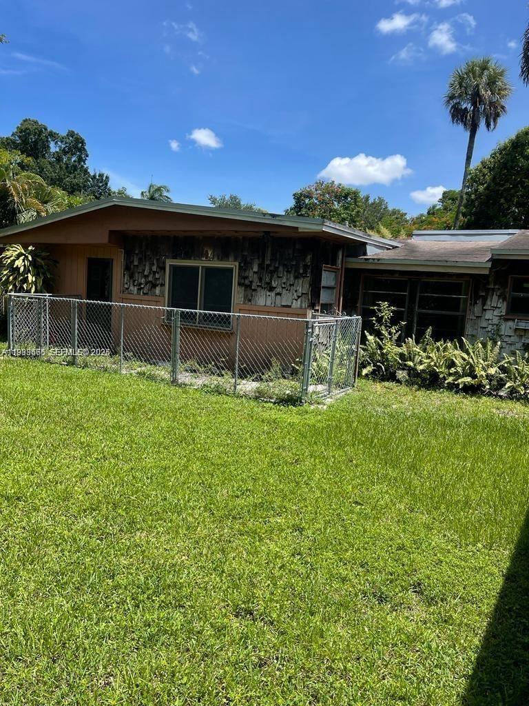 2913 Riverland Road Fort Lauderdale, FL 33312 - Photo 5 of 15 a front view of a house with garden