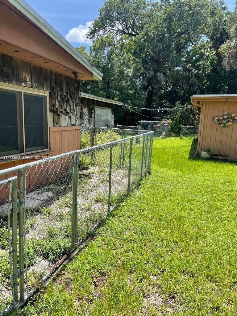 2913 Riverland Road Fort Lauderdale, FL 33312 - Photo 7 of 15 a view of house with backyard and a patio