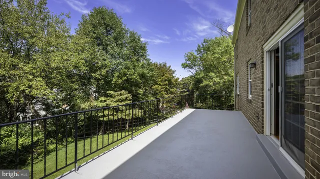 a view of balcony with small yard