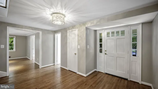 a view of an entryway with wooden floor
