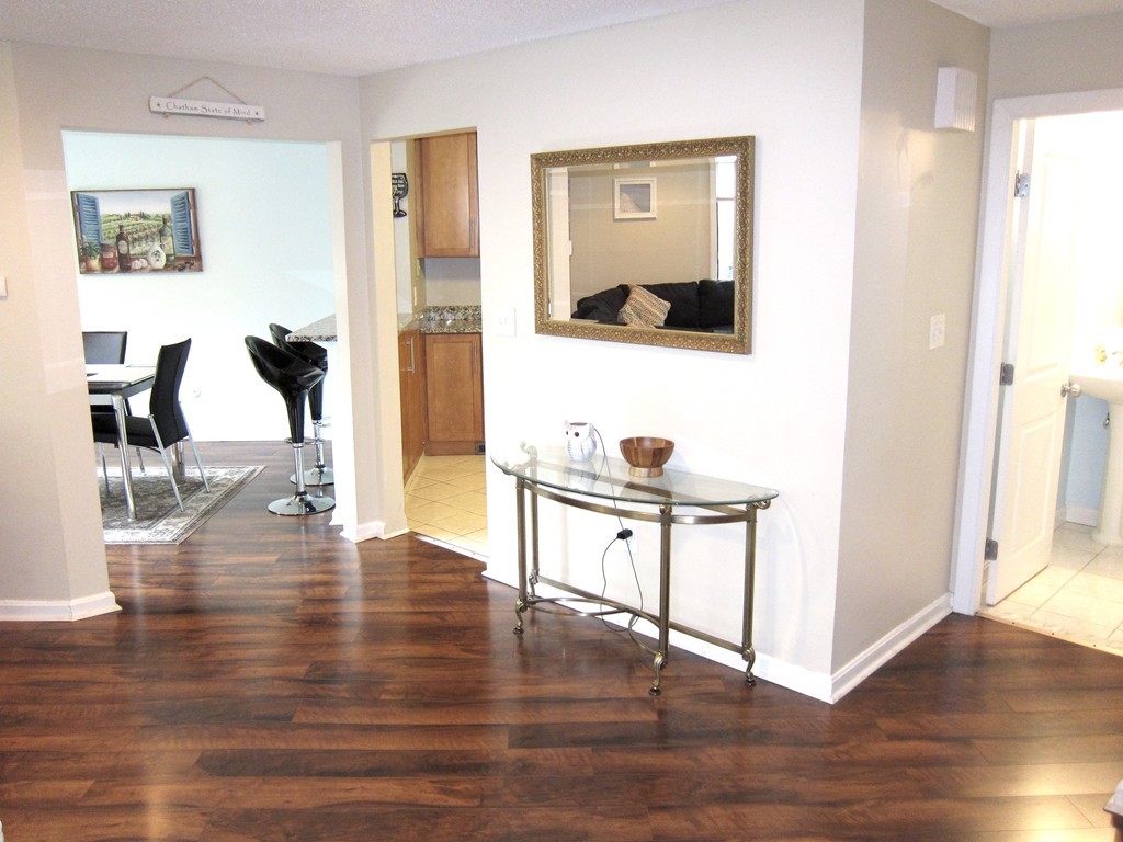 89 Mountain Gate Road, Unit 89 Ashland, MA 01721 - Photo 3 of 22 a view of living room with furniture and wooden floor