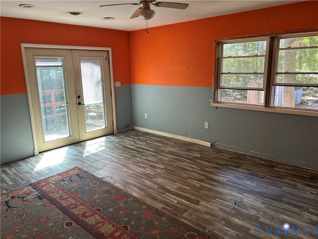 2239 Owl Creek Road Keysville, VA 23947 - Photo 13 of 30 an empty room with wooden floor and windows