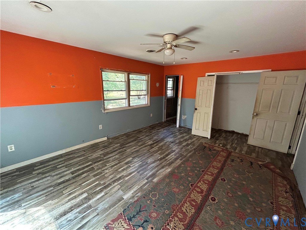 2239 Owl Creek Road Keysville, VA 23947 - Photo 14 of 30 a view of empty room with window and wooden floor