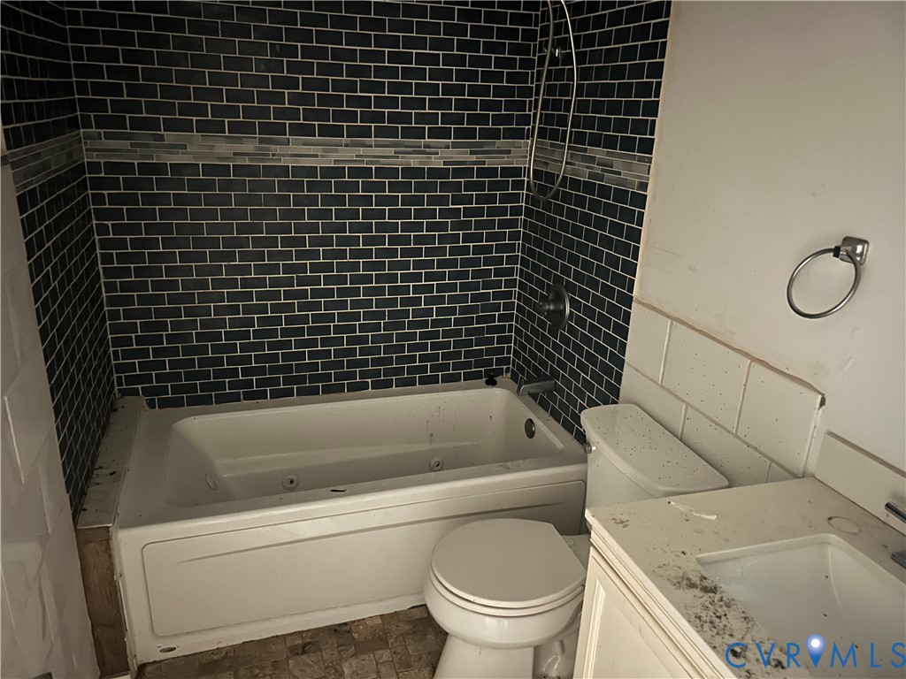 2239 Owl Creek Road Keysville, VA 23947 - Photo 18 of 30 a bathroom with a granite countertop toilet and a bathtub