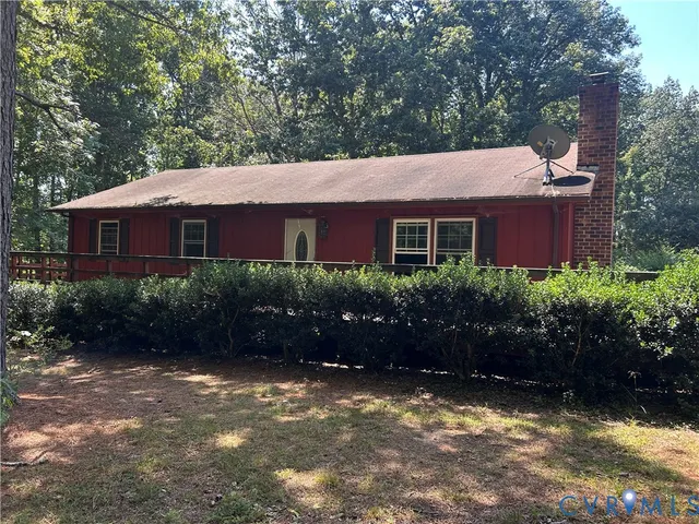 a view of house with outdoor space and garden