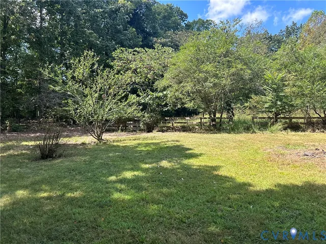 a backyard of a house with lots of green space