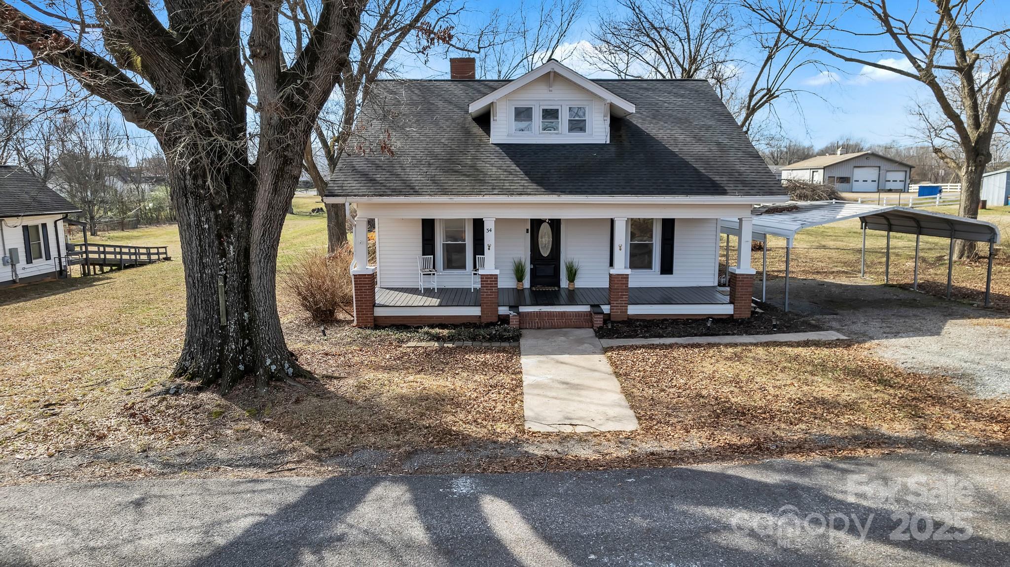 34 Lee Road Stony Point, NC 28678 - Photo 22 of 22 a front view of a house with garden