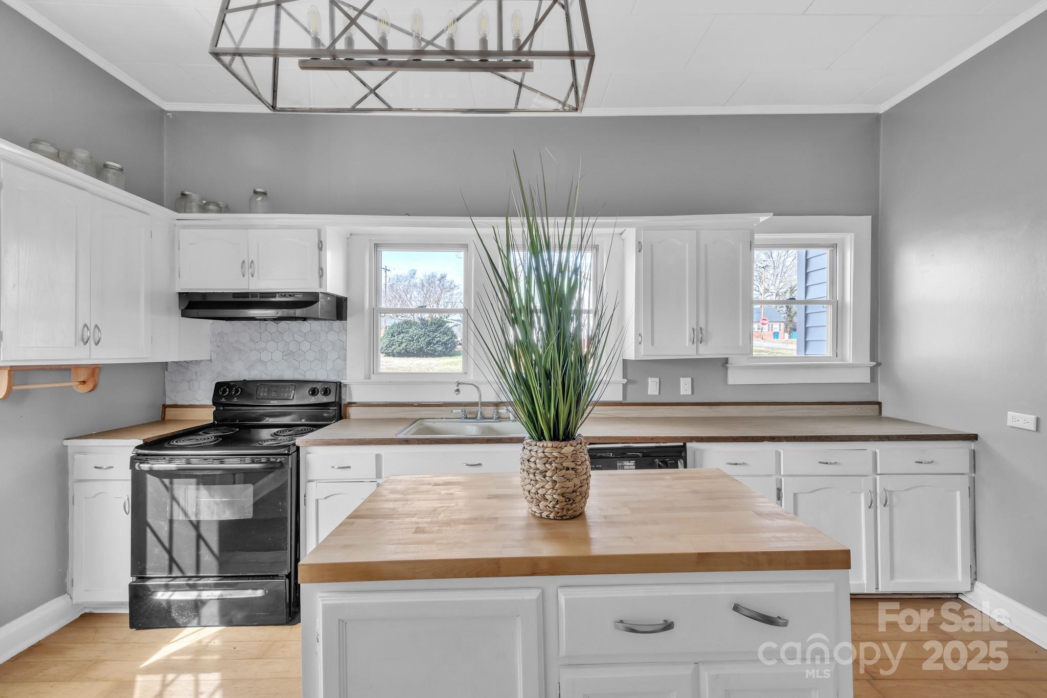 34 Lee Road Stony Point, NC 28678 - Photo 4 of 22 a kitchen with stainless steel appliances granite countertop a stove a sink and a microwave