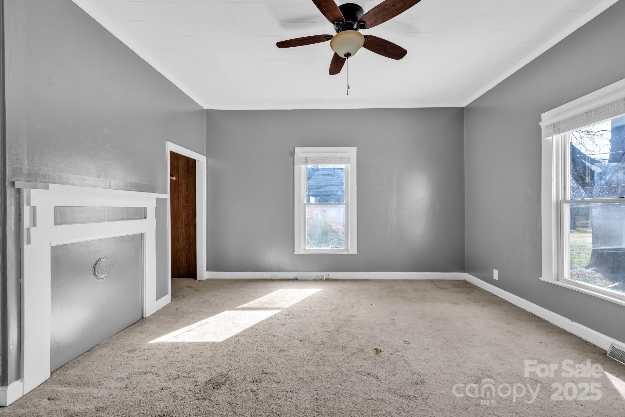 34 Lee Road Stony Point, NC 28678 - Photo 7 of 22 a view of a livingroom with a ceiling fan and window
