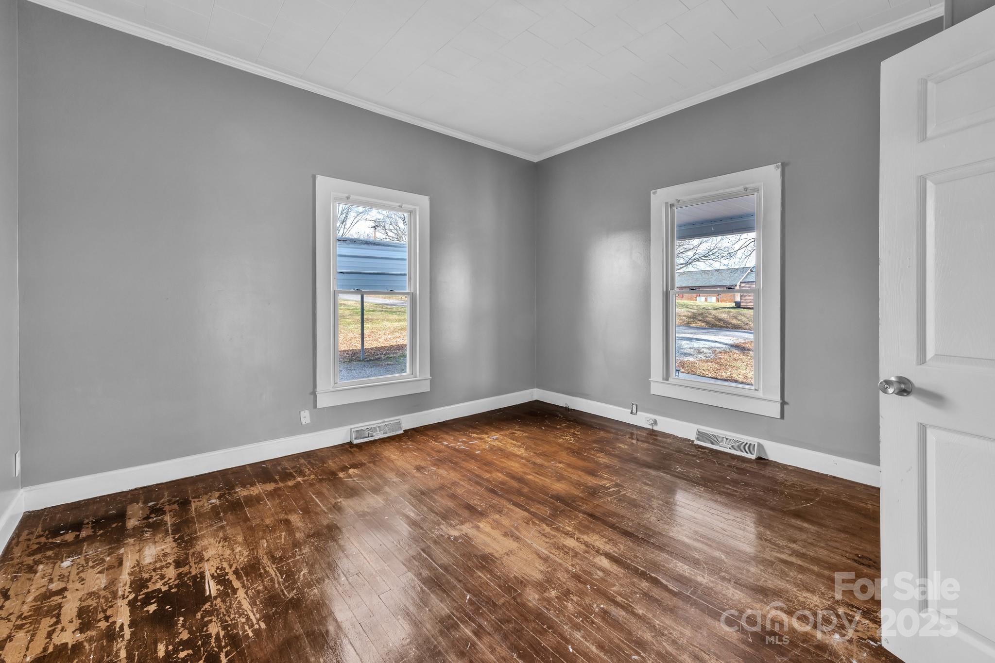 34 Lee Road Stony Point, NC 28678 - Photo 9 of 22 a view of an empty room with wooden floor and a window