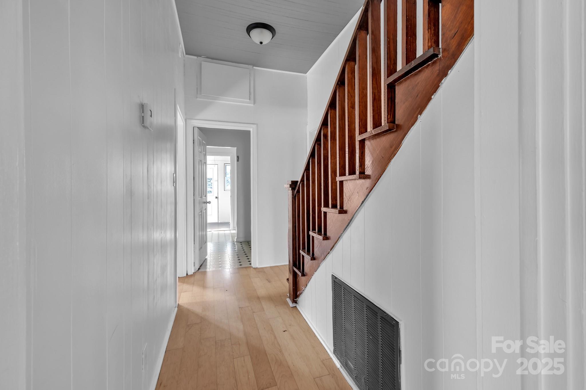 34 Lee Road Stony Point, NC 28678 - Photo 10 of 22 a view of a hallway with wooden floor and staircase