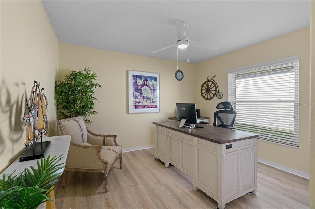 15657 Southwest 11th Terrace Road Ocala, FL 34473 - Photo 21 of 42 a view of a workspace with furniture and a window