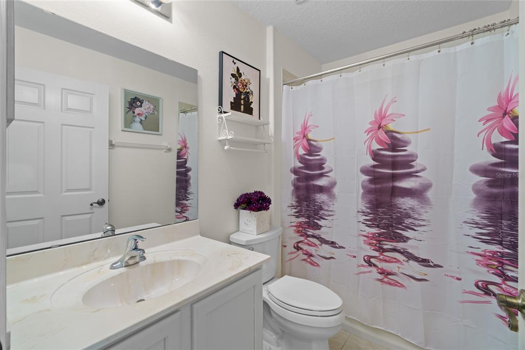 15657 Southwest 11th Terrace Road Ocala, FL 34473 - Photo 22 of 42 a bathroom with a sink toilet and shower