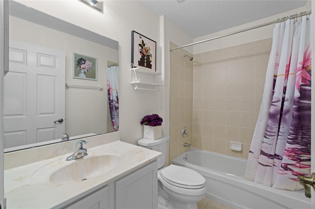 15657 Southwest 11th Terrace Road Ocala, FL 34473 - Photo 23 of 42 a bathroom with a sink toilet and shower