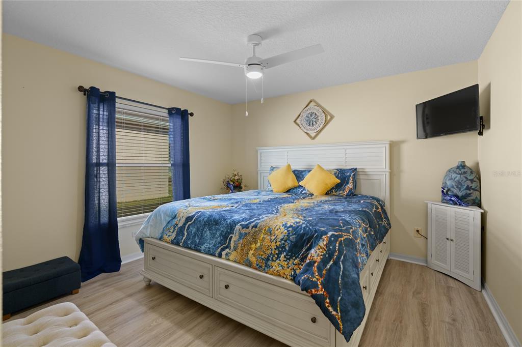 15657 Southwest 11th Terrace Road Ocala, FL 34473 - Photo 24 of 42 a bed room with a bed and a television