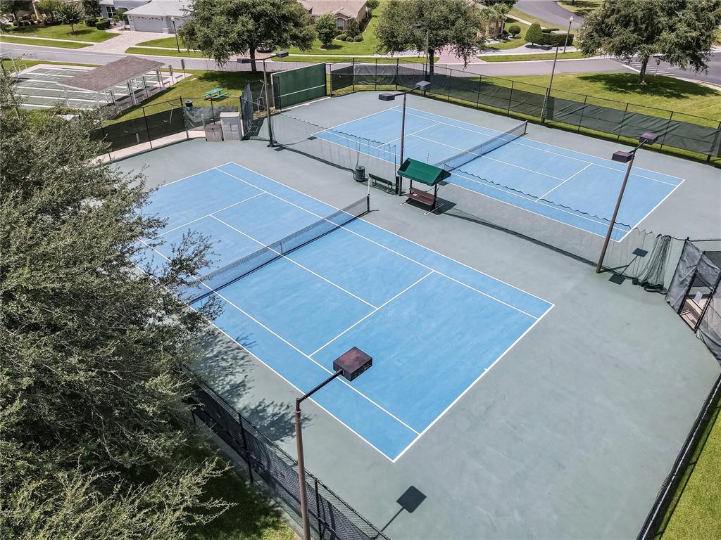 15657 Southwest 11th Terrace Road Ocala, FL 34473 - Photo 40 of 42 an aerial view of a tennis ground with large trees