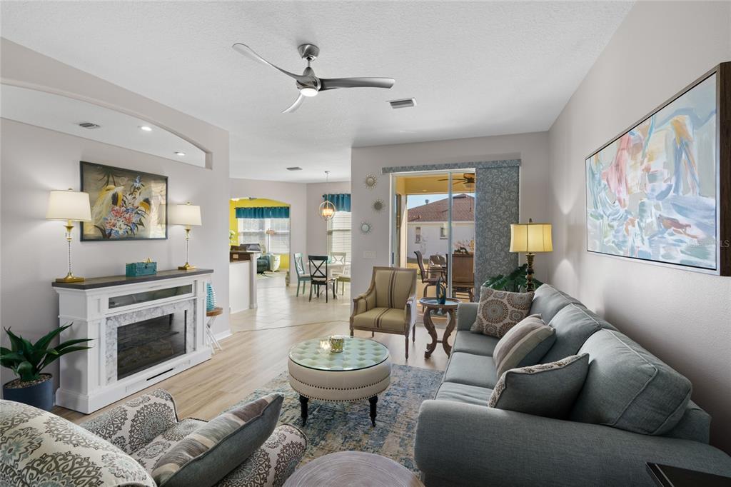 15657 Southwest 11th Terrace Road Ocala, FL 34473 - Photo 4 of 42 a living room with furniture and a fireplace