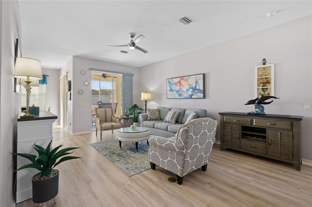 15657 Southwest 11th Terrace Road Ocala, FL 34473 - Photo 5 of 42 a living room with furniture or couch and a potted plant