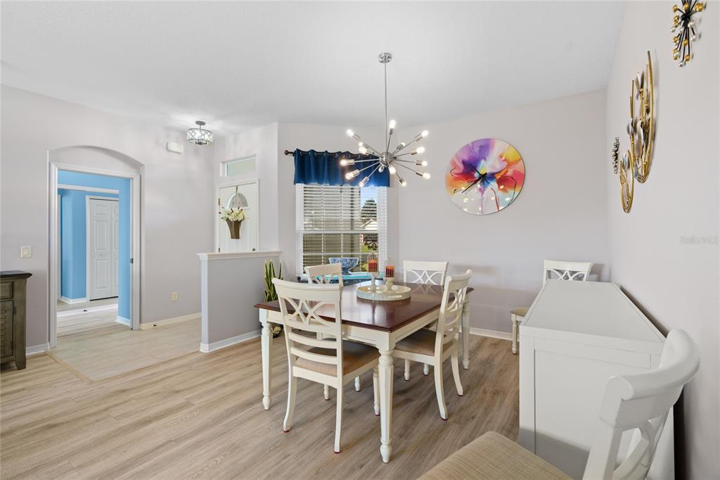 15657 Southwest 11th Terrace Road Ocala, FL 34473 - Photo 6 of 42 a view of a dining room with furniture and chandelier