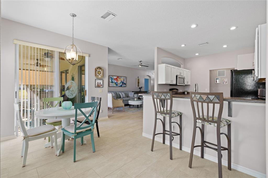 15657 Southwest 11th Terrace Road Ocala, FL 34473 - Photo 10 of 42 a view of a dining room with furniture window and outside view