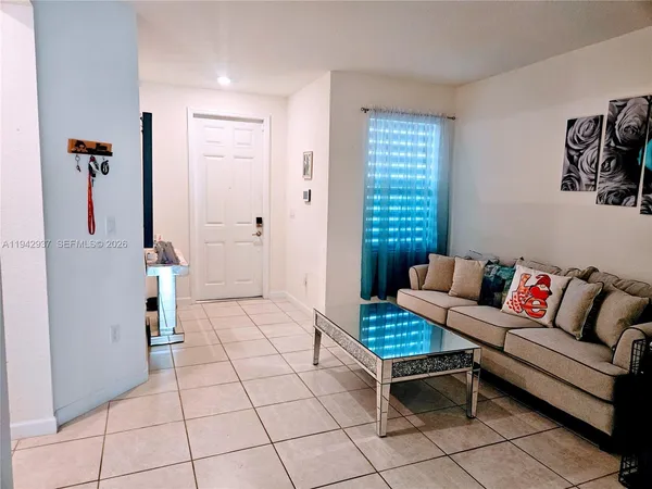 a living room with furniture and a window