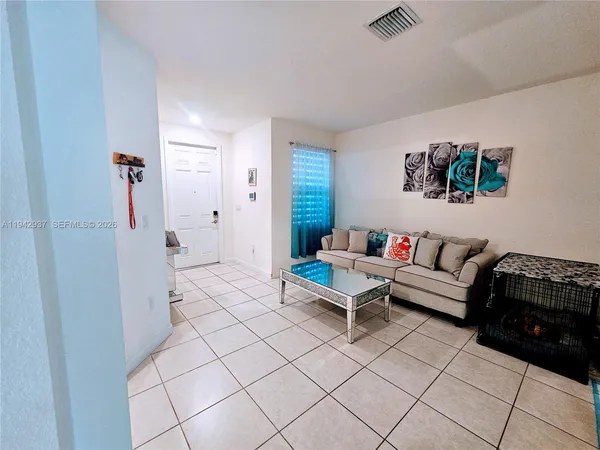 a living room with furniture and a rug