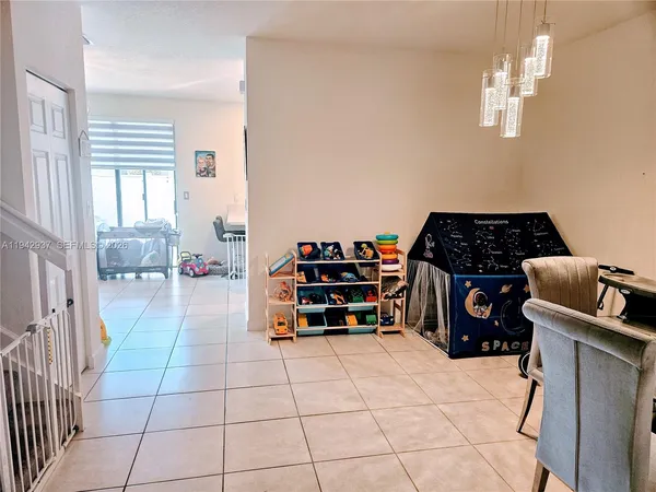 a bedroom with furniture and cabinets