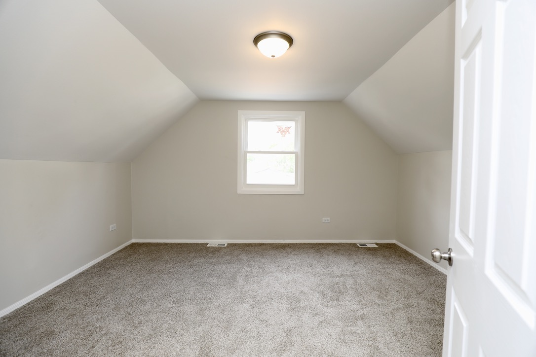 544 Spruce Road Bolingbrook, IL 60440 - Photo 8 of 13 an empty room with a window