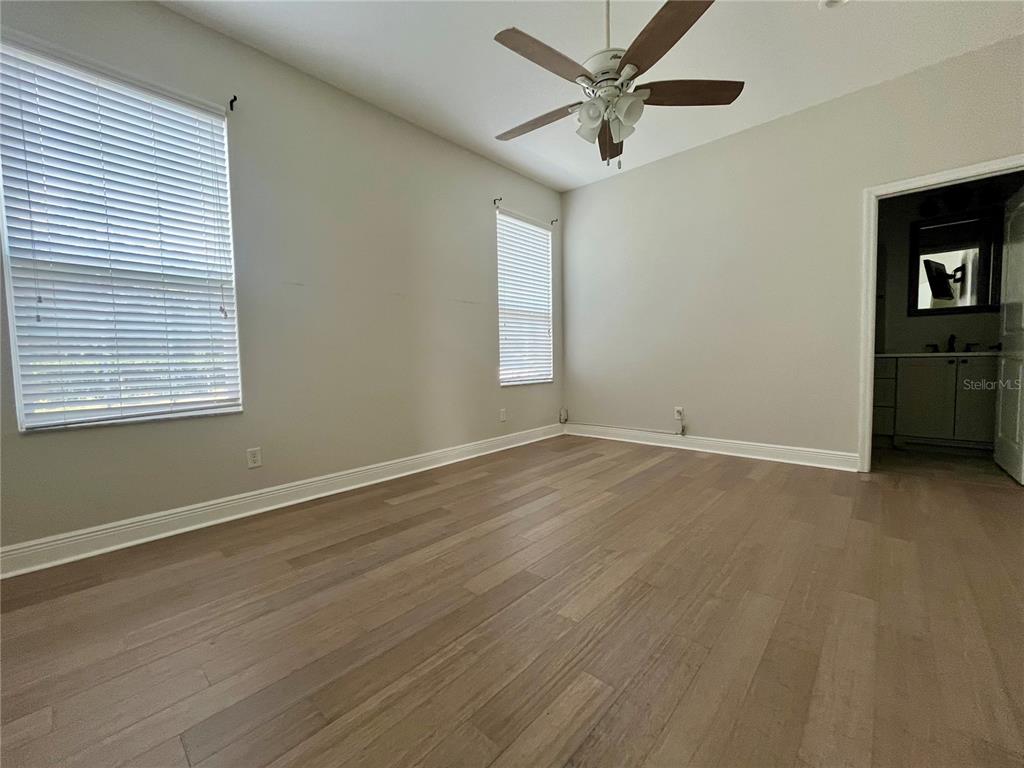 6328 Barton Road Plant City, FL 33565 - Photo 18 of 28 wooden floor in an empty room with a window