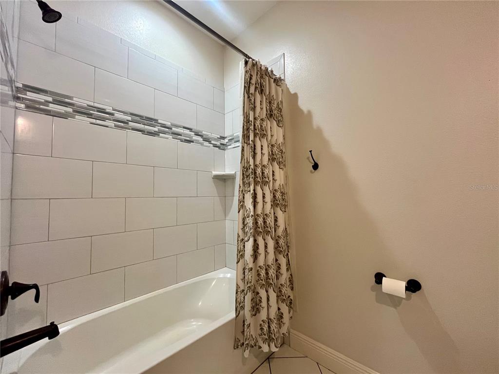 6328 Barton Road Plant City, FL 33565 - Photo 23 of 28 a bathroom with a shower