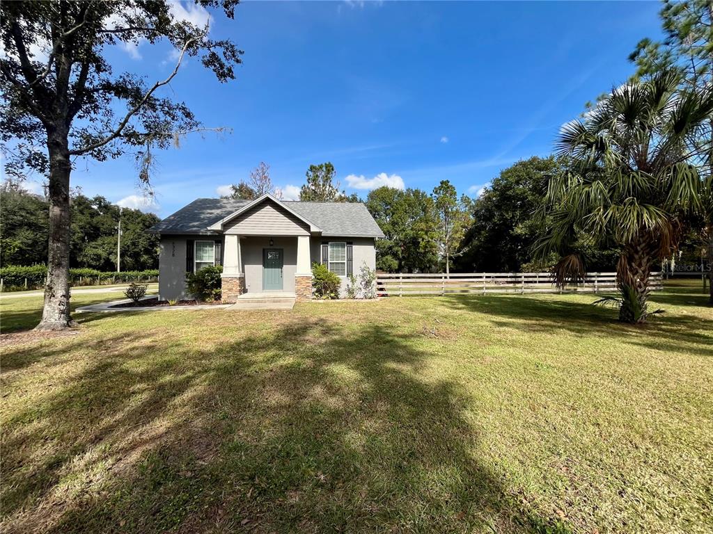 6328 Barton Road Plant City, FL 33565 - Photo 6 of 28 a view of a house with a swimming pool