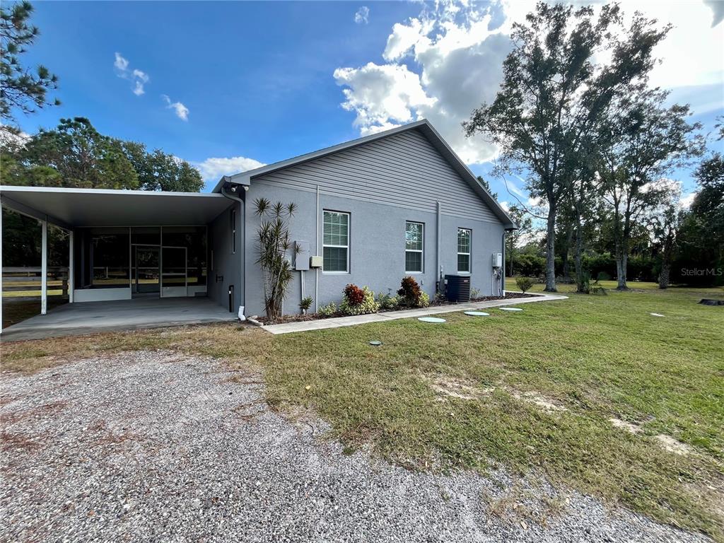 6328 Barton Road Plant City, FL 33565 - Photo 10 of 28 a view of a house with backyard and a tree