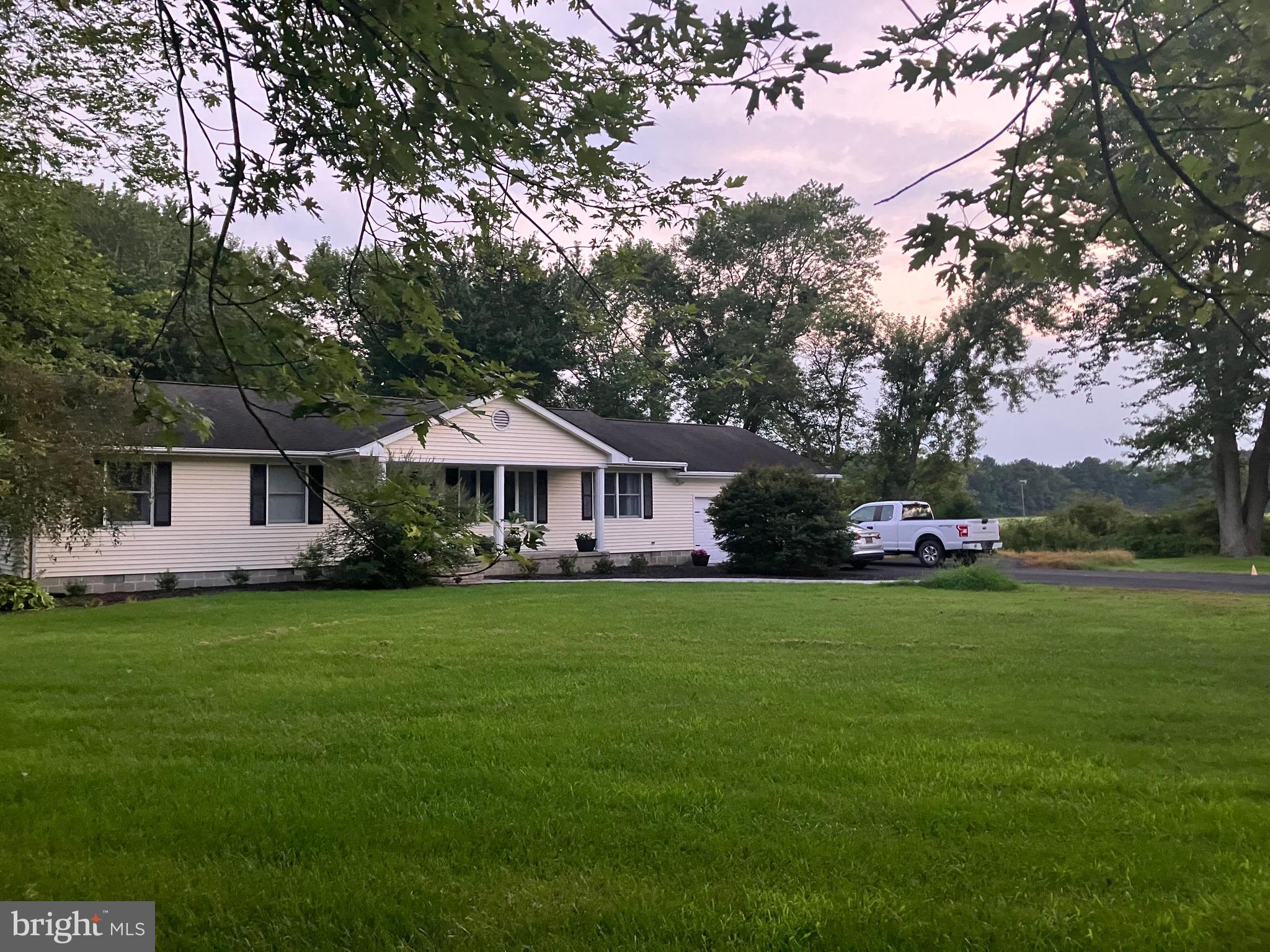 28736 Stockley Road Milton, DE 19968 - Photo 2 of 35 a front view of a house with a garden