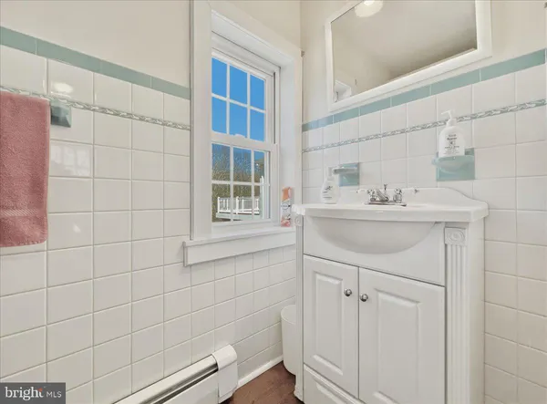 a kitchen with cabinets appliances and a window