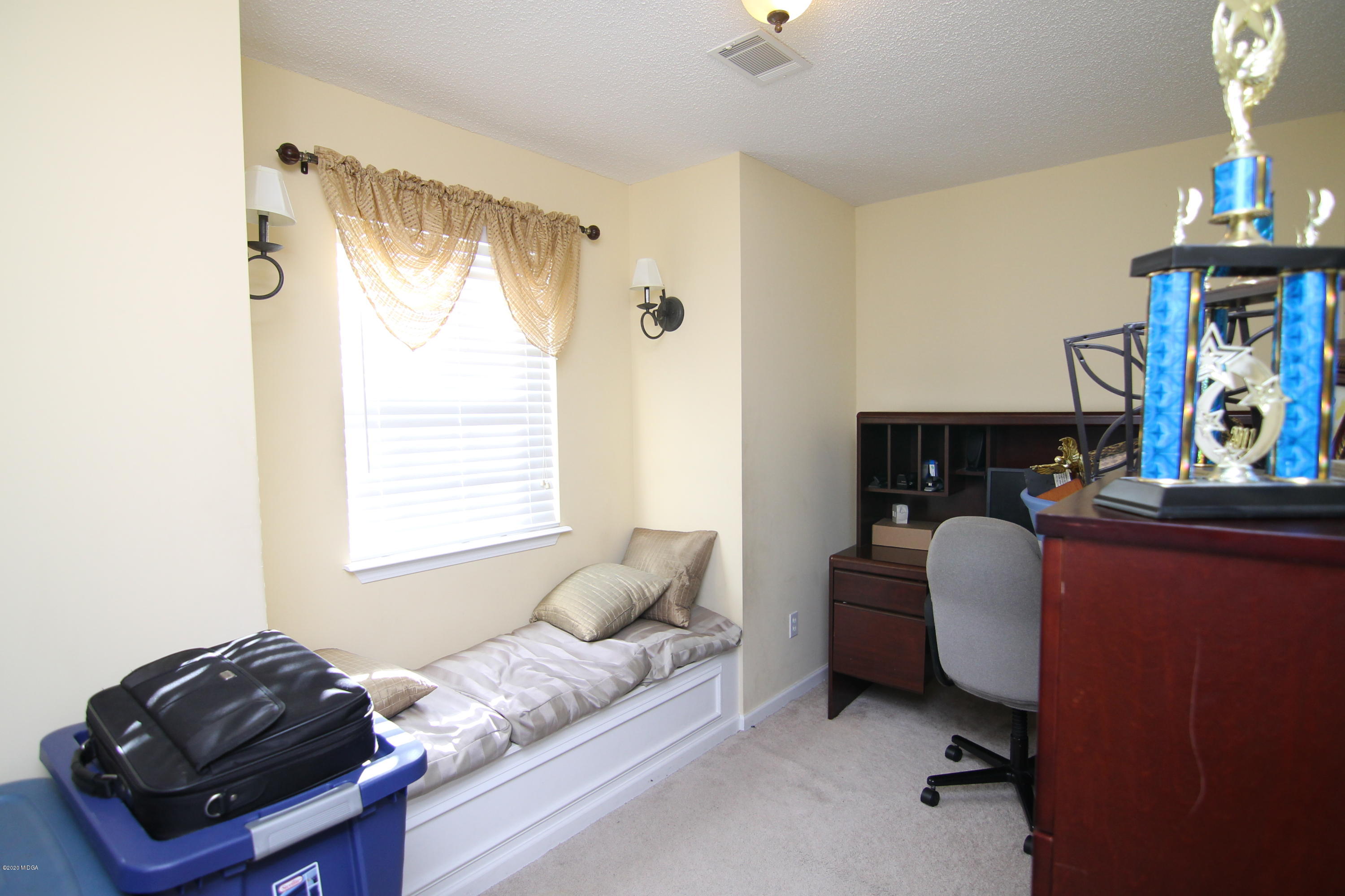 226 Ruben Road Byron, GA 31008 - Photo 23 of 30 a living room with furniture and a window