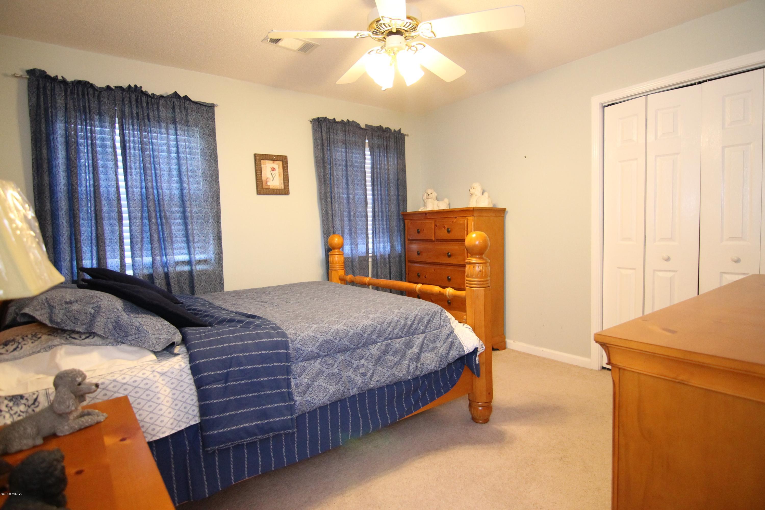 226 Ruben Road Byron, GA 31008 - Photo 27 of 30 a bedroom with a bed and a dresser