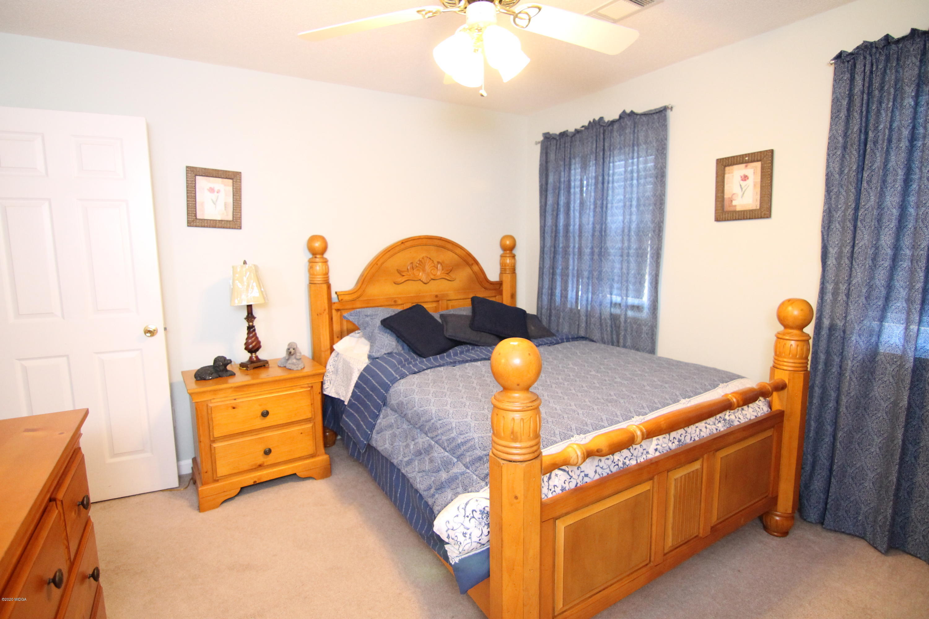 226 Ruben Road Byron, GA 31008 - Photo 28 of 30 a bed room with a bed and mirror